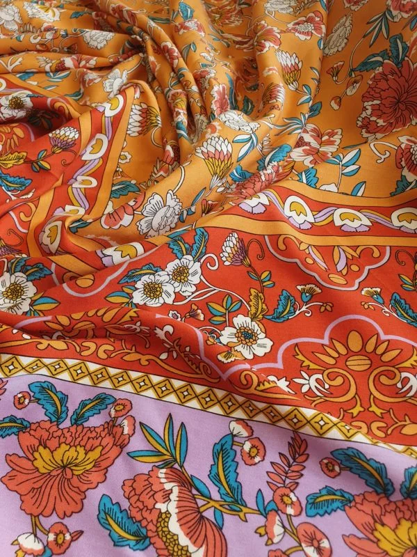 Border Printed Viscose in bold Orange/Red/Gold/Mauve